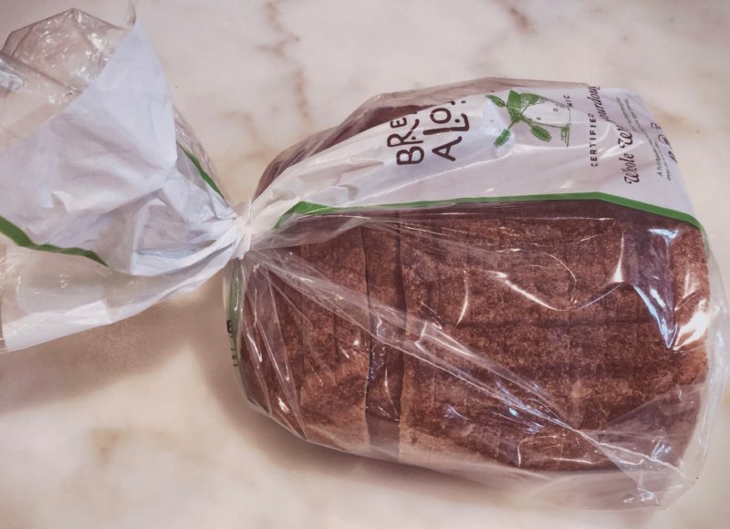 A plastic bag law doesn't mean you can't get a plastic bag. A perfect option for poop pickup is a bread bag.