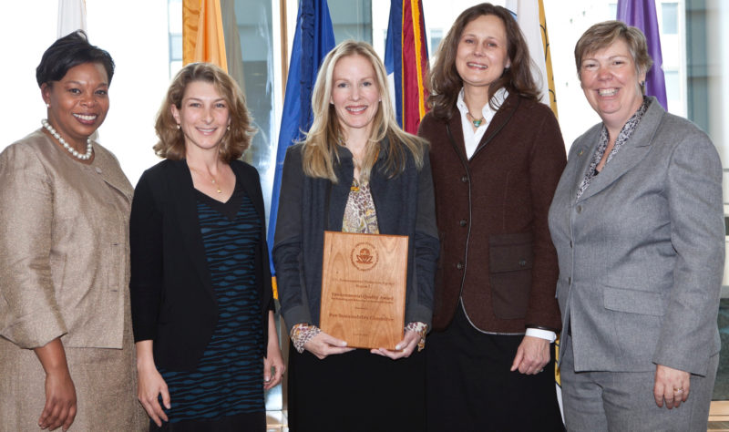 Sara Goddard receiving the EPA Environmental Quality Award for plastic bag legislation.