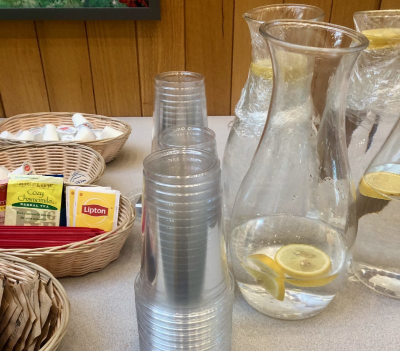 Plastic cups, stirrers, and plastic wrap featured at a recent sustainability event. 